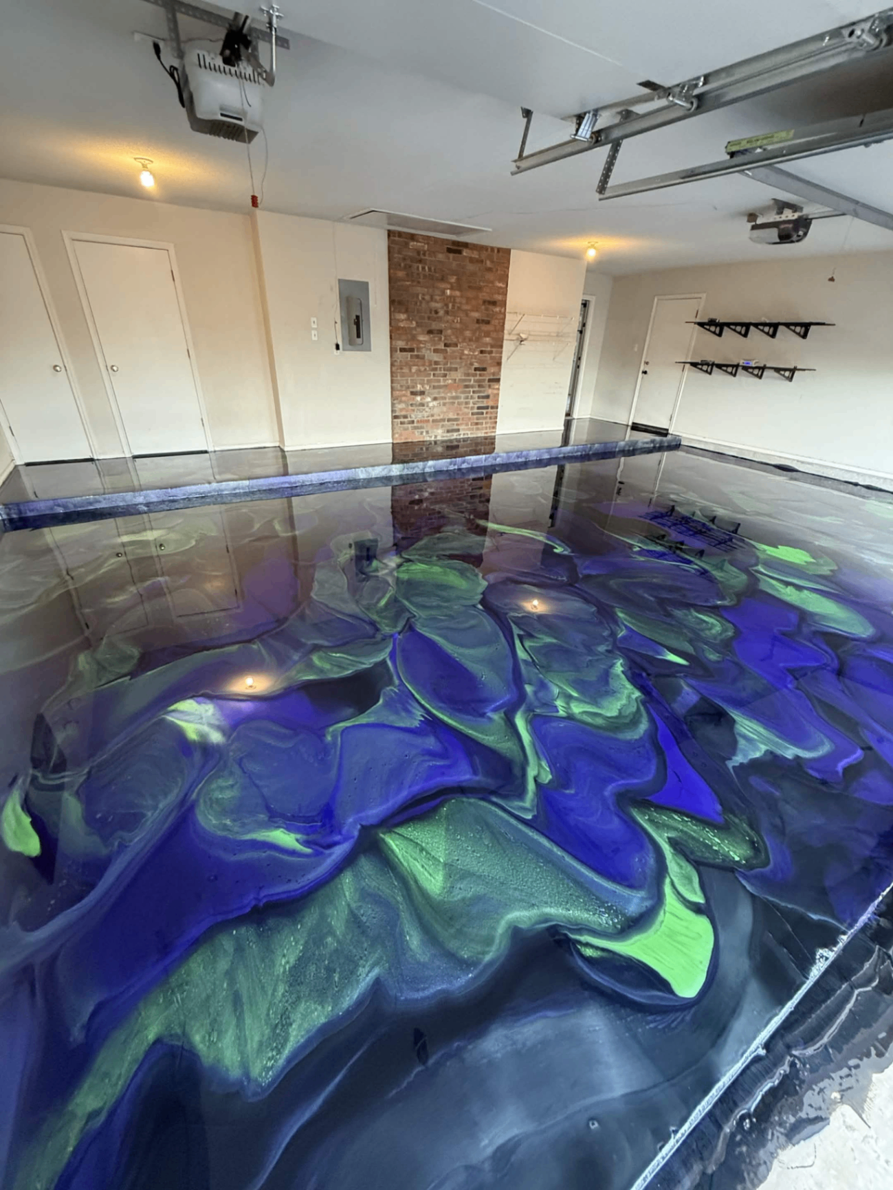 Blue and green metallic floor in an open garage