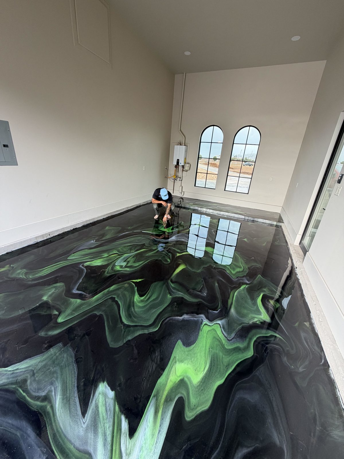 green and black metallic epoxy garage floor by Ellett Epoxy