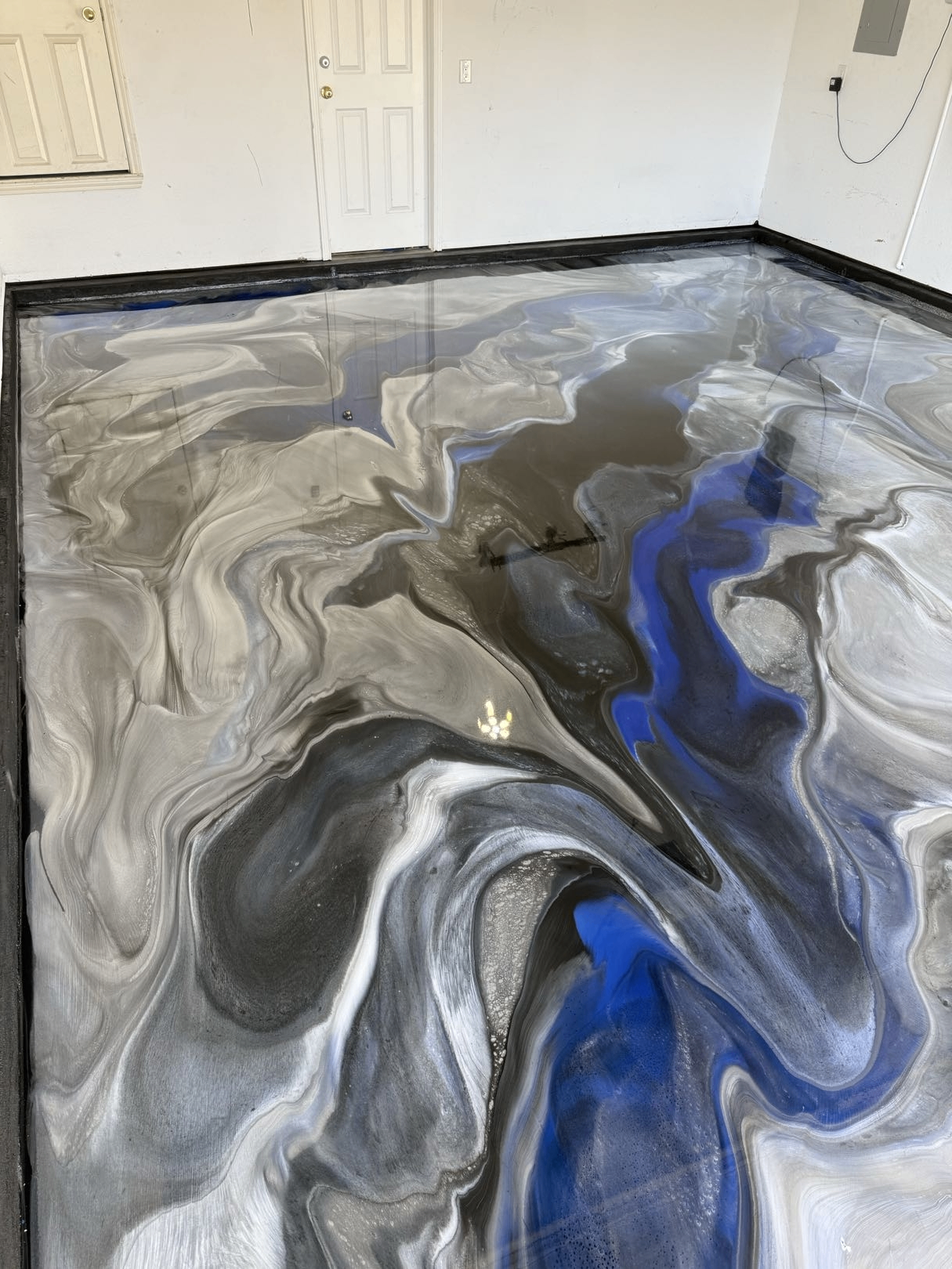 Ocean Chrome metallic epoxy floor by Ellett Epoxy